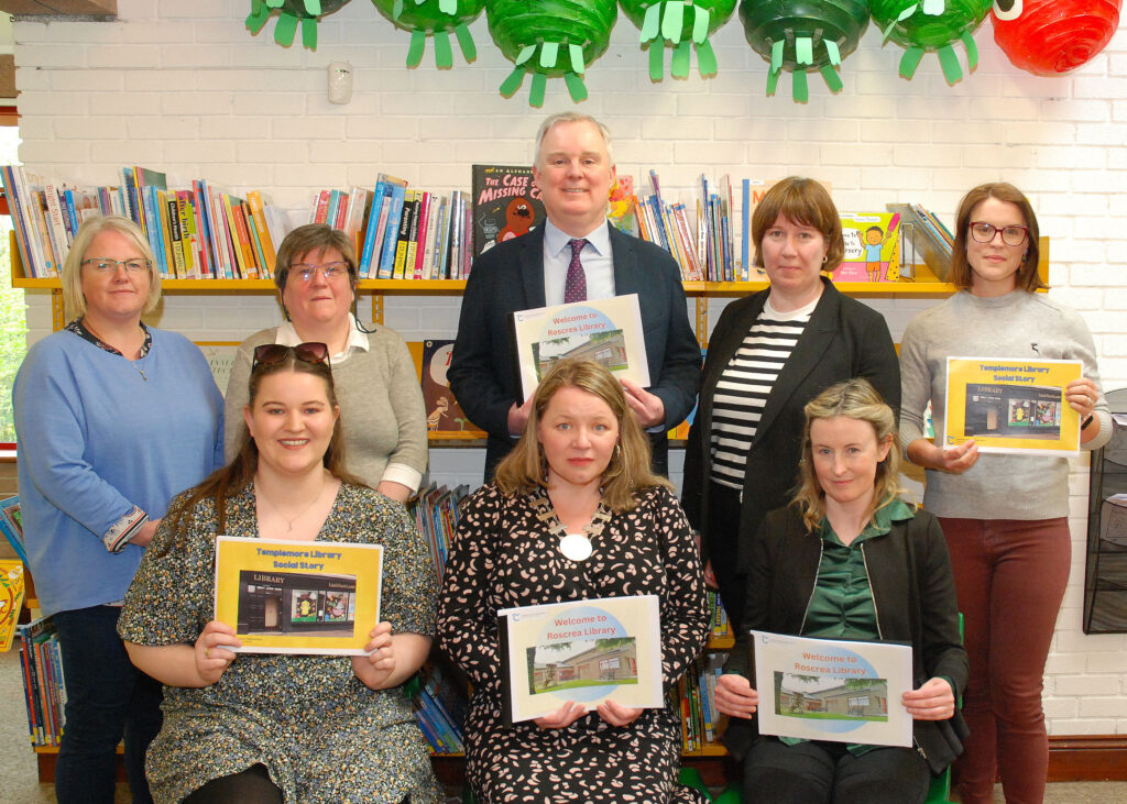 Social Stories Launch in Roscrea Library with a picture of (Standing, left to right): Marguerite Ryan, Autism Awareness Roscrea, Áine Beausang, Roscrea Library; Damien Dullaghan, County Librarian; Ann Marie Brophy, Senior Executive Librarian, Marissa Hayes, Autism Awareness Roscrea; (Seated, Left to Right): Rachel Hoban, Templemore Library, Cllr Peggy Ryan, Cathaoirleach Thurles MD; Valerie Madden, Roscrea Library