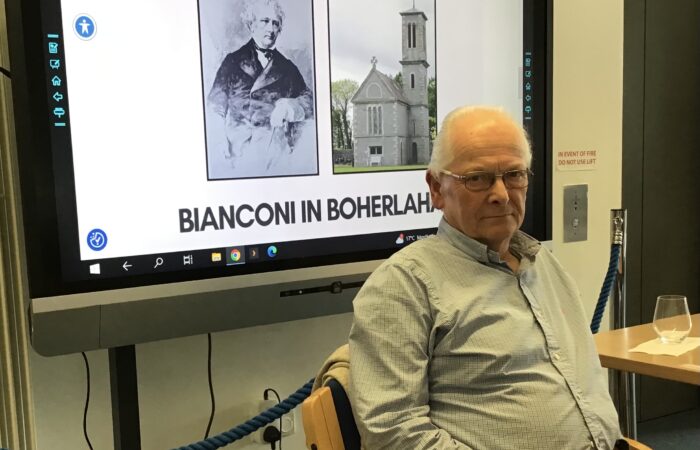 Liam O'Duibhir seated.